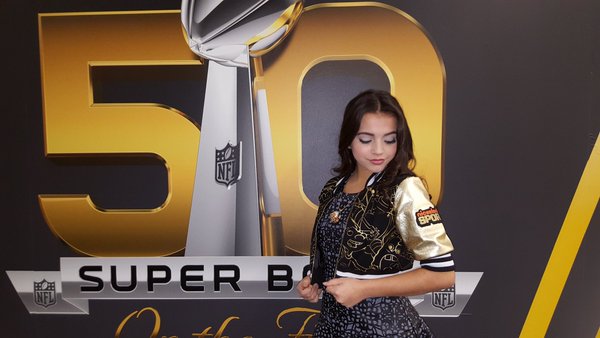 Article: Isabela Moner Gives An Inside Look On How To Warm Up Before Singing The National Anthem At The NFL FLAG Championships!